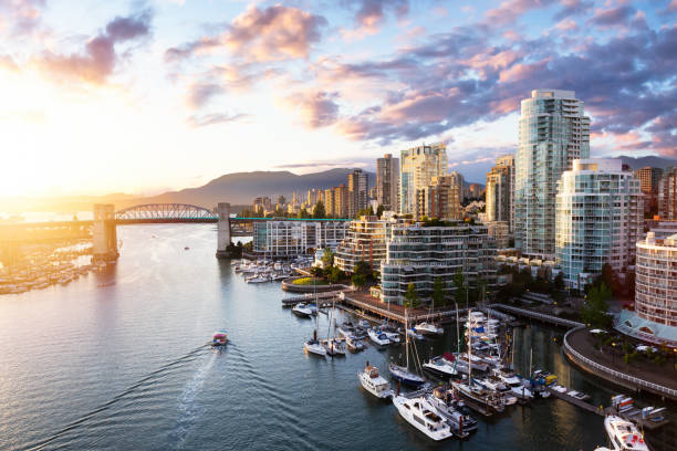 False Creek, Downtown Vancouver, British Columbia, Canada. False Creek, Downtown Vancouver, British Columbia, Canada. Beautiful Aerial View of a Modern City on the West Pacific Coast during a colorful Sunset. Sky Composite vancouver canada stock pictures, royalty-free photos & images