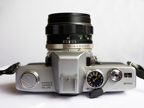 London / UK - May 16, 2020: Minolta SR-T 101 with MC Rokkor-PF 1:1.4 f=58mm vintage 35mm analog film camera, Top view.launched in 1966.