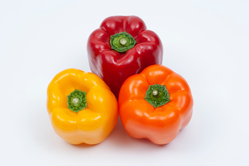 PAPRIKA.Fresh yellow and red bell pepper isolated on white background. Bulgarian salad pepper .Fresh vegetables. Harvest. Vegan. close up