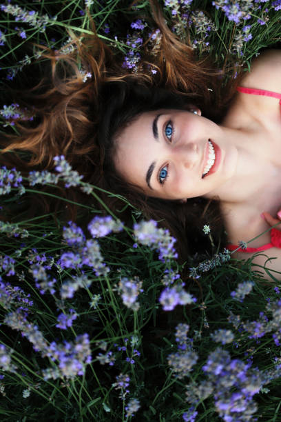 istock Girl laying in lavander field 1225290161