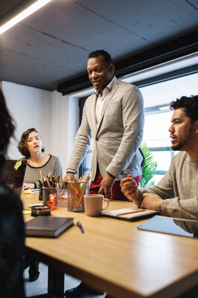 istock Acknowledging your teams contribution during a team meeting 1225290229