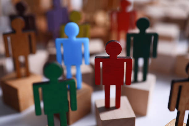 istock Colored wooden figures in form man stand table 1225290243
