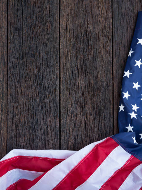 istock America flag waving pattern on wooden background in table top view, red blue white strip concept for USA 4th july independence day, symbol of patriot freedom and democracy. Glory pride in memorial day of liberty 1225290449