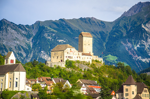 Vaduz town, Liechtenstein, September 15, 2016: Old castle in front of mountains Alps