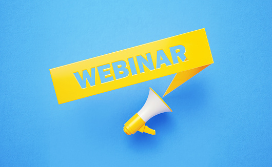 Webinar written yellow chat bubble and yellow megaphone on blue background. Horizontal composition with copy space. Webinar concept.