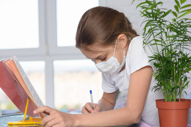 istock A sick girl teaches homework and does homework 1225298447