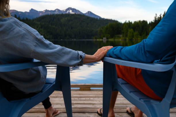 istock Couple holding hands on a lake vacation 1225302571