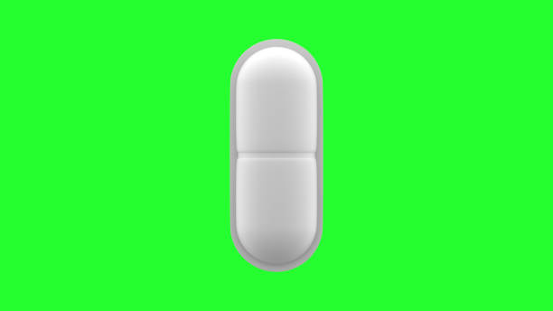 istock White pills isolated. Green Screen. 4K UHD. 3d rendering. 1225303407
