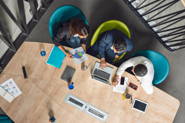 istock Co-workers working in their business in a coworking office 1225316212