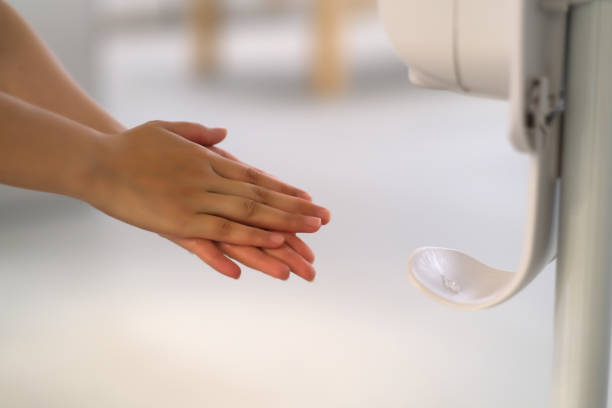 istock Close up people using water-free hand sanitizer to clean hands. Prevent coronavirus concept. 1225316930
