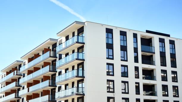 istock Modern condo building with big windows and modern facade. 1225318139