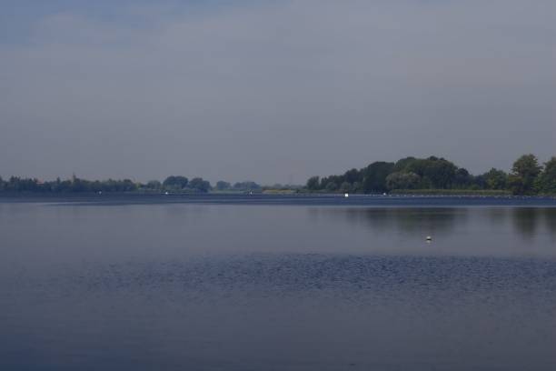 istock A lake with trees in the distance 1225318780