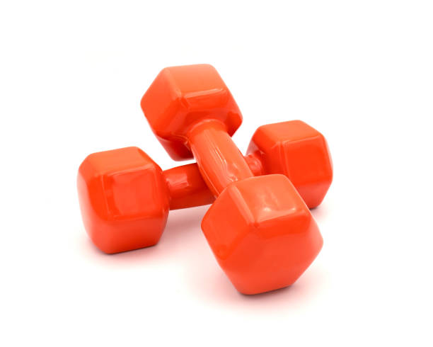 istock A pair of orange dumbbell isolated on white 1225318803