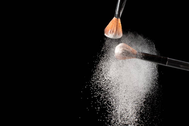 istock Two brushes with  white powder impact to make a  white cloud. 1225323818
