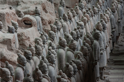 The Terracotta Army was buried with the Emperor of Qin (Qin Shi Huangdi) in 210-209 BC (his reign over Qin was from 247 BC to 221 BC and over unified China from 221 BC to his death in 210 BC). Their purpose was to help rule another empire with Shi Huangdi in the afterlife. Consequently, they are also sometimes referred to as \