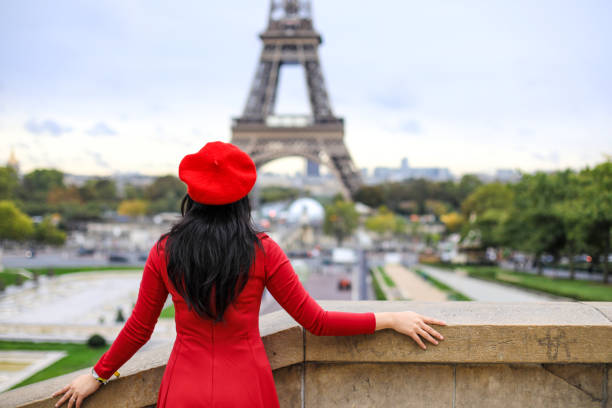 istock asian young traveler walking in front of Eiffel Tower 1225328409