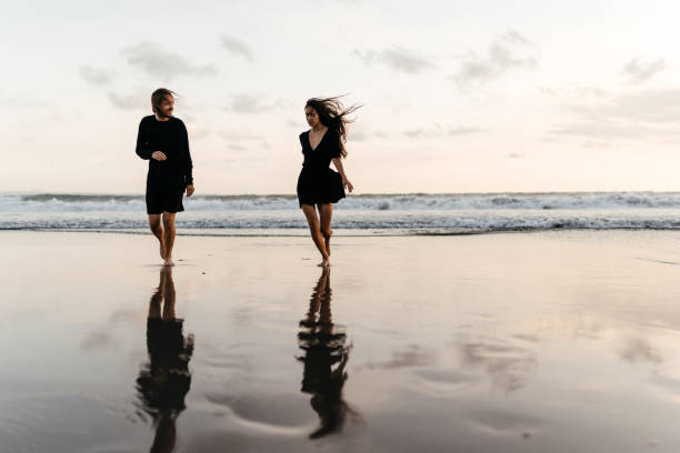 istock Attractive man and woman enjoying romantic evening on sunset 1225328654