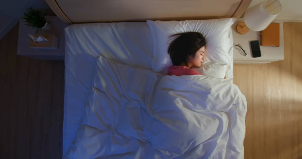 asian woman sleep well overlooking of asian woman sleep well with smile at night sleep stock pictures, royalty-free photos & images