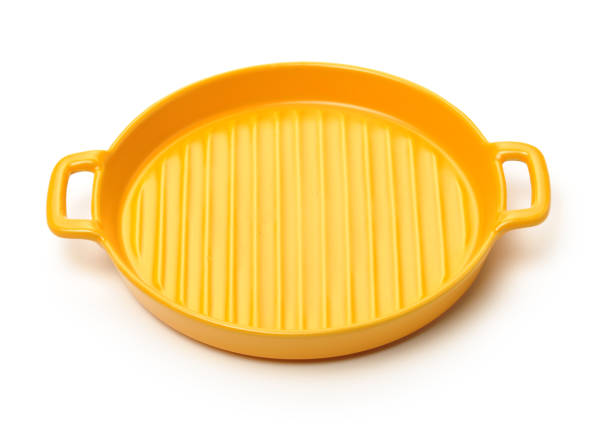 istock Classic yellow ceramic casserole dish with handles 1225329886