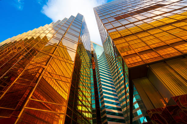 istock Modern buildings with gold and glass facades 1225330025