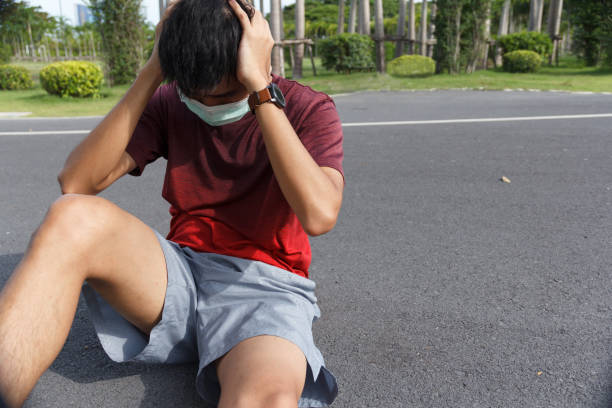 istock The man is tired from a workout rest. Man athlete suffering a headache and dizziness. 1225330939