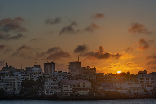 The sun sets with Mombasa Island in the foreground