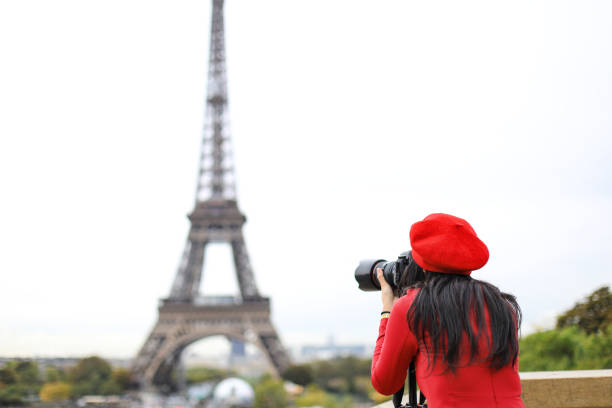 asian women traveler taking photograph with her camera