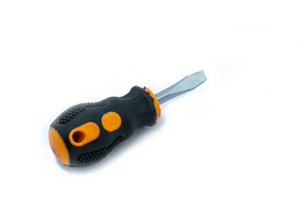 A professional slotted Screwdriver with a Yellow-Black plastic handle. construction tool isolated on white background. Cruciform for repair and construction.