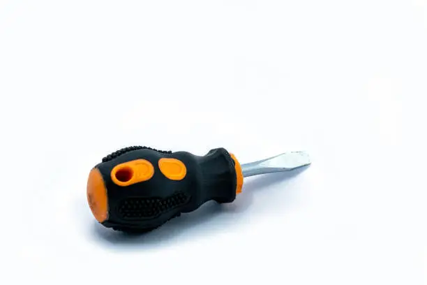 A professional slotted Screwdriver with a Yellow-Black plastic handle. construction tool isolated on white background. Cruciform for repair and construction.