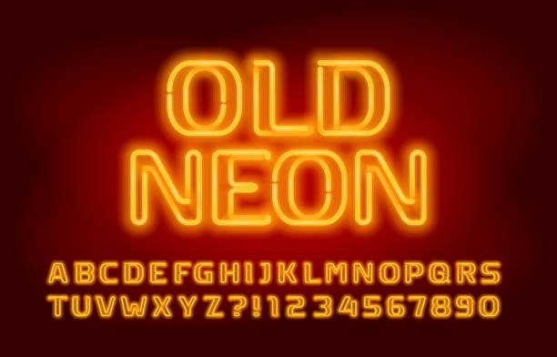 istock Old Neon alphabet font. Glowing yellow neon color letters and numbers. 1225339770