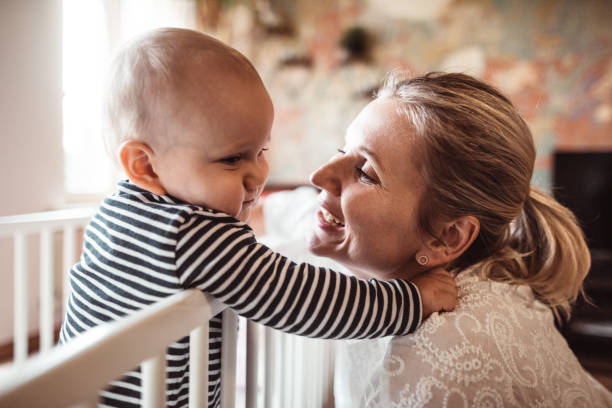 istock mother and son at home in the crib 1225341960