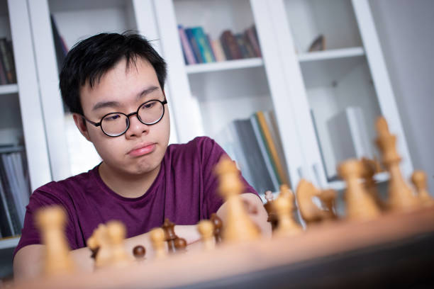 istock Teenager practising chess at home during quarantine 1225343475