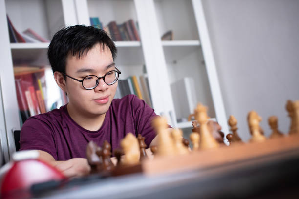 istock Teenager practising chess at home during quarantine 1225343553