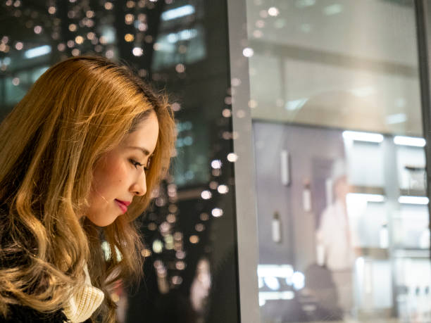 istock Young woman enjoying window shopping 1225344851
