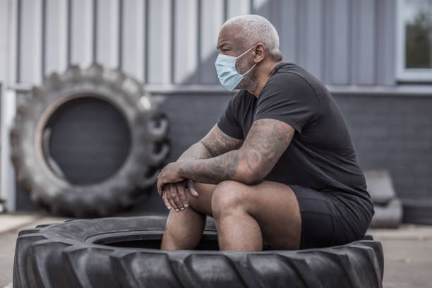 istock A black male working out wearing a face mask during virus outbreak 1225346233