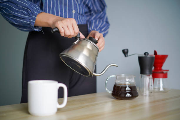 istock Young woman with her coffee brewing equipment 1225349928