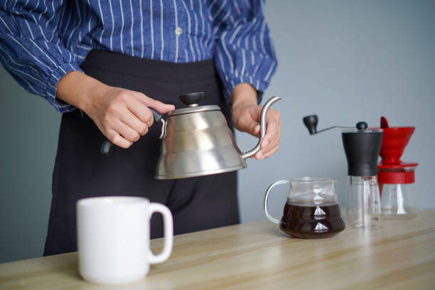 istock Young woman with her coffee brewing equipment 1225350181