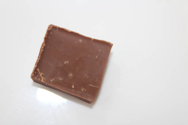 istock A piece of chocolate on white background. 1225351214