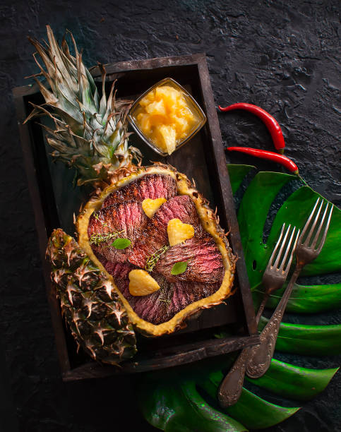 Pineapple stuffed with meat and grilled