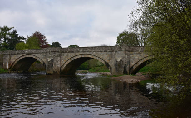 istock Arched Bridge in England Over Water 1225352841