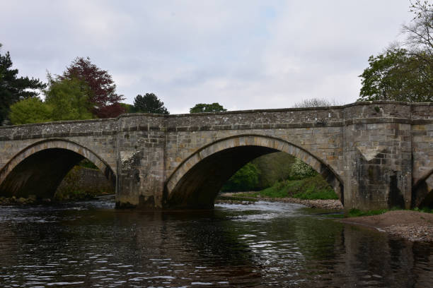 istock Arched Bridge in England Over Water 1225352868