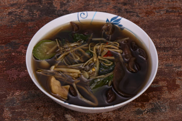 istock Thai style soup with meat and mushrooms 1225353039