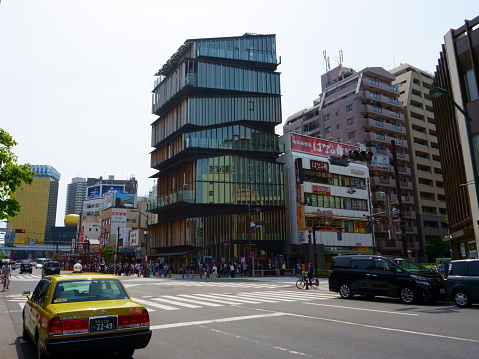 Tokyo / Japan - May 05, 2019: Road in the Asakusa district. Asakusa Culture Tourist Information Center building