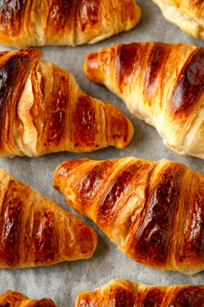 istock Freshly baked croissants with butter. background, texture 1225355392