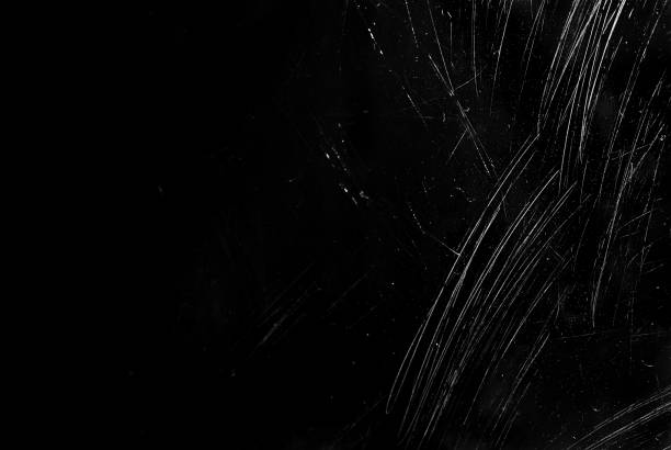 istock White scratches and dust on black background. Old dirty glass. 1225355711