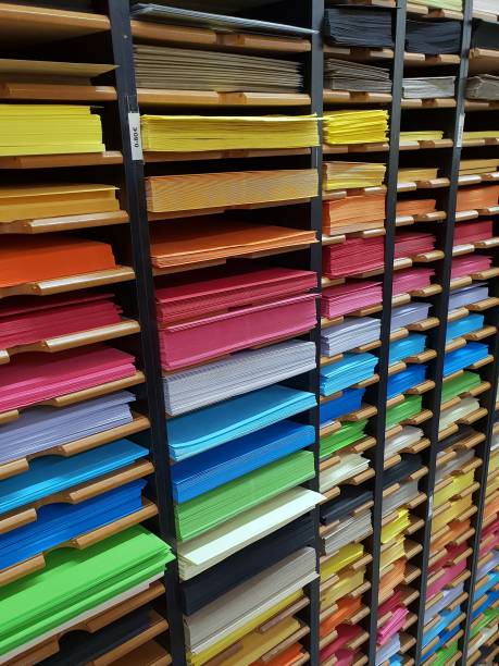istock Perspective of a shelf full of different coloured papers. Background with objects related to art, design, crafts, painting. Concepts related to education, learning, artistic studies, or school. 1225356251