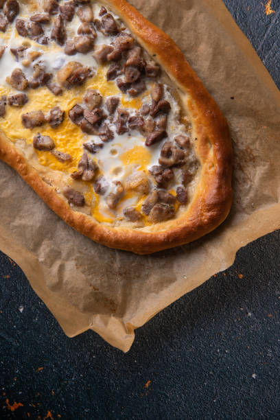 istock Cubed roasted Pork on Macedonian pizza pide 1225356631