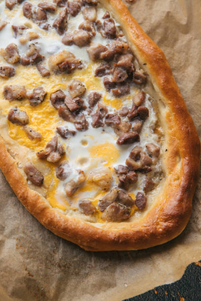 istock Cubed roasted Pork on Macedonian pizza pide 1225356652