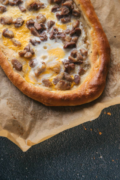 istock Cubed roasted Pork on Macedonian pizza pide 1225356724