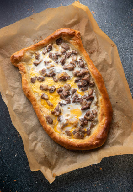 istock Cubed roasted Pork on Macedonian pizza pide 1225356748